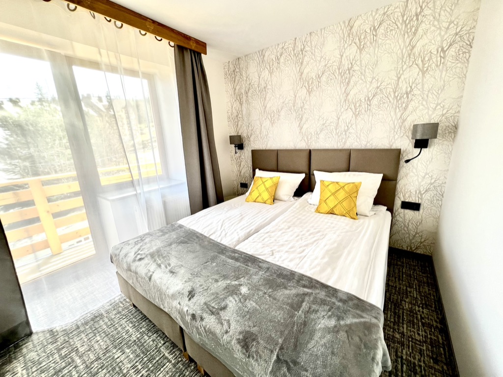 Chybotek room – bed and balcony door